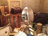 A close up of the bathroom items and purses.