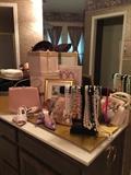 More items in the bathroom, vintage shoes and purses. Costume jewelry, vintage hat boxes and hats