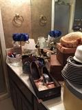 More vintage hats and shoes, other bathroom accessories.