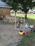 Back yard, Patio table with 6 chairs, metal plant stands, lots of pots and metal containers