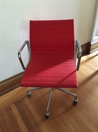 Several Eames Aluminum Office Chairs