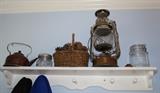 antique oil lamp, vintage tea kettle and more  Great shelf for a mud room, too.
