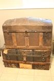 two steamer trunks - very old.  the bottom one has an image of the ship they sailed on.