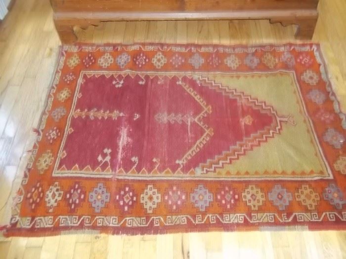 Antique knotted rug