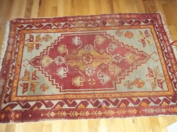 Antique knotted rug