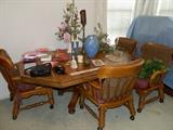 Game table with leaf and four matching chairs on rollers. Decor items, miscellaneous collectibles