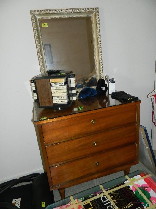 Mid Century modern chest, mirror on wall, 8 track tapes, 8 track holder, miscellaneous items