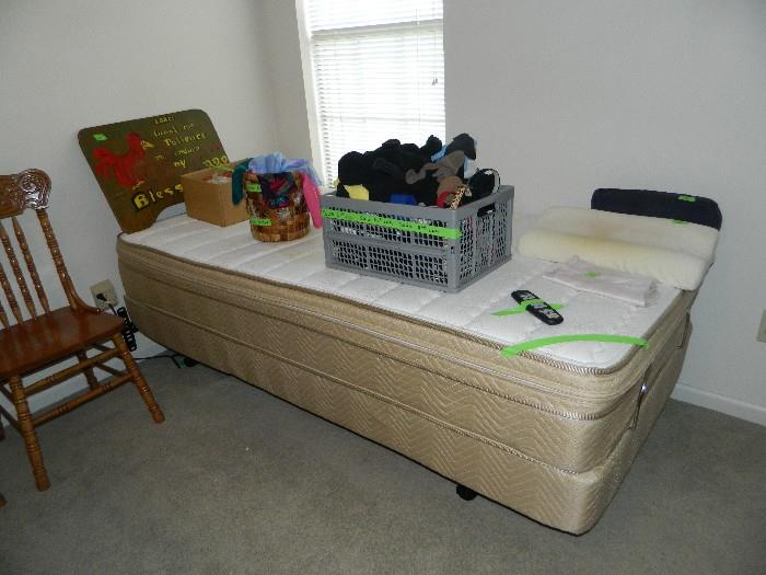 Two of these adjustable twin beds.  Both have the remotes; additional chair, box of socks, belts, etc.  also a bin of scarves.  {Pillows, etc.)