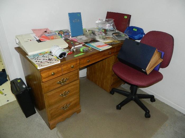 Desk in master bedroom, typewriter and various other office supplies