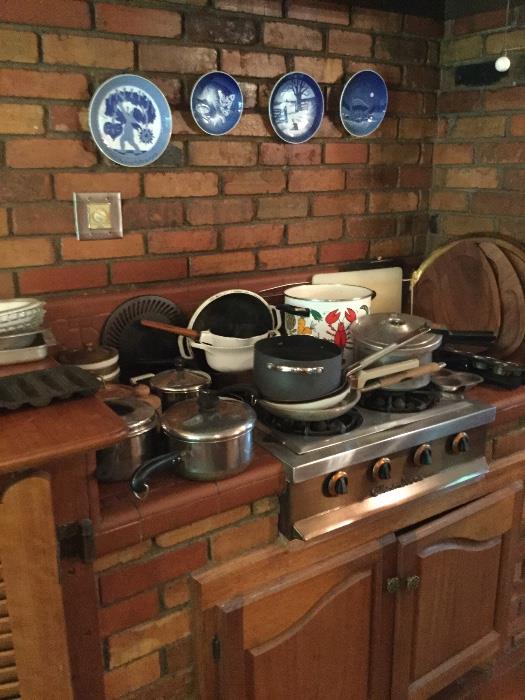Kitchen full of pots, pans, and ovenware