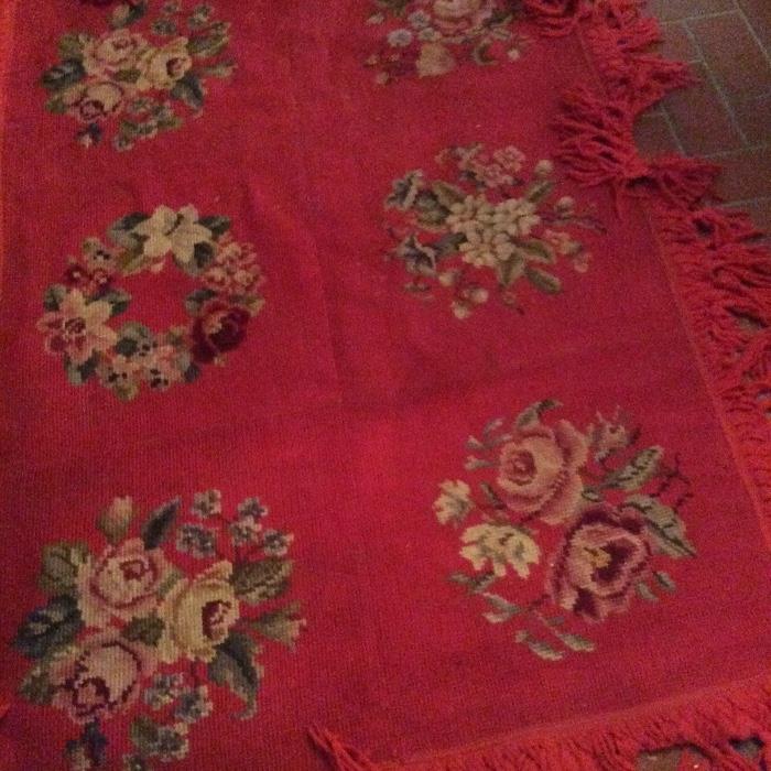 Hand stitched gross point rug in vibrant red.