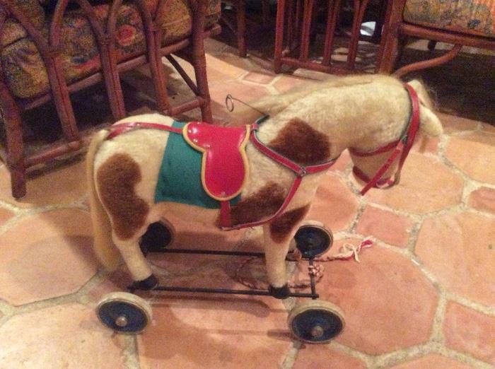 Vintage pull toys including this Steiff mohair horse approximately 18" tall. Complete and in wonderful condition.