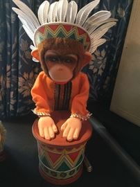 Vintage Monkey in headdress with Indian drum.