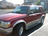 1998 Ford Explorer 4WD Eddie Bauer Edition, Red/Tan, 154,359 miles, Tan leather interior, Sunroof, Hatch-style trunk, Remote key and powerless entry, New battery in 2010, 2 small dings on bumper, Tear in leather on center console, Radio works but LED display doesn't, radiator leaks & needs replacing.