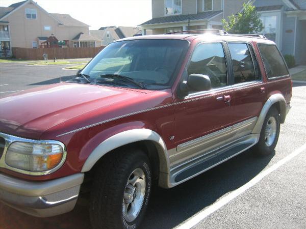 1998 Ford Explorer 4WD Eddie Bauer Edition, Red/Tan, 154,359 miles, Tan leather interior, Sunroof, Hatch-style trunk, Remote key and powerless entry, New battery in 2010, 2 small dings on bumper, Tear in leather on center console, Radio works but LED display doesn't, radiator leaks & needs replacing.