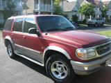 1998 Ford Explorer 4WD Eddie Bauer Edition, Red/Tan, 154,359 miles, Tan leather interior, Sunroof, Hatch-style trunk, Remote key and powerless entry, New battery in 2010, 2 small dings on bumper, Tear in leather on center console, Radio works but LED display doesn't, radiator leaks & needs replacing.