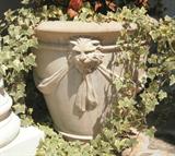 Pair of cement planters, 24" high x 25" wide. $50 each