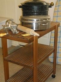 Wooden cart w/enamelware canner and stainless roaster; meat grinder and rolling pin