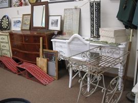 Ramps, iron flower cart, antiqued kneehole desk, Standard Measures Metal Sign, Bow front Wooden Dresser