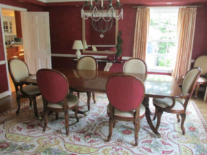 Baker double pedestal table with three leaves and eight Century chairs.