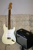 Squier Strat Electric Guitar by Fender with Speaker