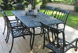 out door cast aluminum table and chairs 65" x 40" with umbrella and cushions, only 3-4 years old.
