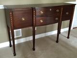 Mahogany sideboard with locking, lined drawer.  Genuine hand-made bell flower inlays decorate each leg.