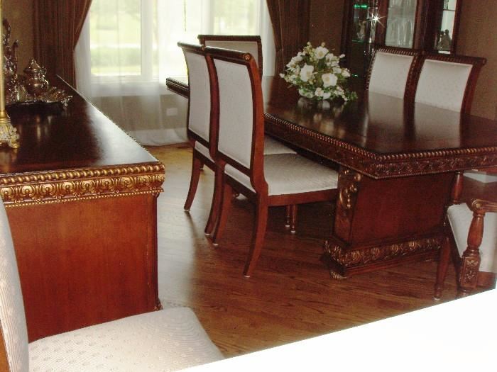Dining room set imported from Italy. Stunning. Amazing wood work. Table is one large piece  96" long. Comes with 10 matching chairs, buffet and china cabinet