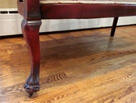 Setee:  Dark cherry frame, front claw feet, on wheels, innerspring seat