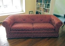 Very nice sofa with tufted back and continuous rolled arms and back.  Solid and well made (maker unknown, as it has been reupholstered).