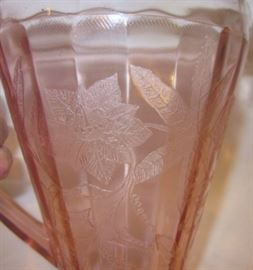 Depression glass pitcher and glasses by Jeannette Glass, "Floral Poinsettia" pattern.