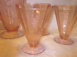 Depression glass pitcher and glasses by Jeannette Glass, "Floral Poinsettia" pattern.