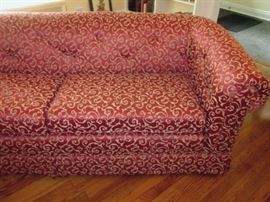 Very nice sofa with tufted back and continuous rolled arms and back.  Solid and well made (maker unknown, as it has been reupholstered).