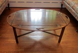 Vintage oval butler's table.  Sides flip up and have carrying handles.