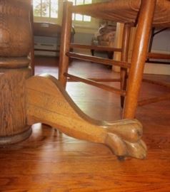 Antique 42" round table.  Solid oak pedestal base with carved feet, on wheels, pine top - minor condition issues.