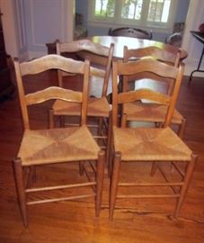 Four antique chairs, all wood construction (no nails, screws), with original rush seats.
