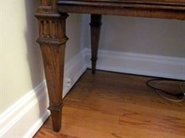 High-quality desk by Sligh.  Three tooled leather inlays, 5 drawers, brass drawer pulls.  One spot of damage to leather.