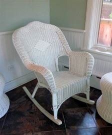 Vintage white wicker rocking chair.