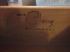Two solid Cherry wood end or side tables, with shelf, two bottom drawers and brass pulls by Harden.  Tops have some staining from plants.  32" wide, 19" deep, 22" tall.