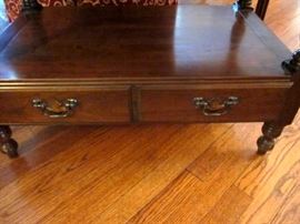 Two solid Cherry wood end or side tables, with shelf, two bottom drawers and brass pulls by Harden.  Tops have some staining from plants.  32" wide, 19" deep, 22" tall.