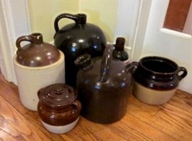 Vintage moonshine jugs and bean pots