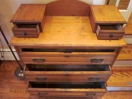 Antique Eastlake 3-drawer dresser on wheels, with two small vanity drawers, brass hardware.  Back has been modified, as it has no mirror.