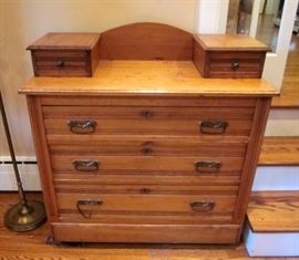 Antique Eastlake 3-drawer dresser on wheels, with two small vanity drawers, brass hardware.  Back has been modified, as it has no mirror.