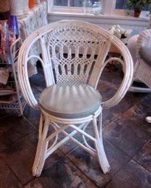 Vintage white wicker arm chair.