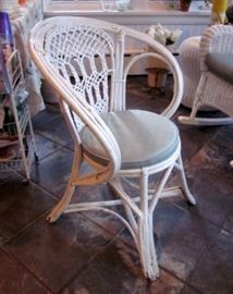 Vintage white wicker arm chair.