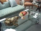 A large frog for your garden.  Porcelain fruit bowl on a large glass coffee table - with metal base.
