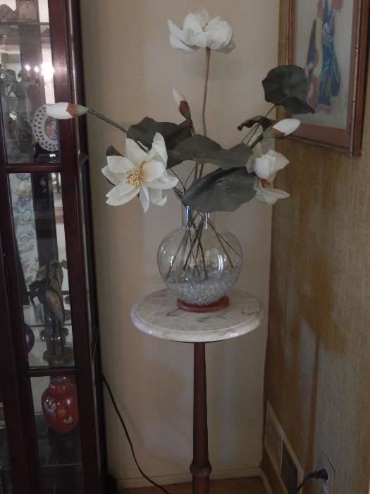 marble top entry stand with magnolia flower