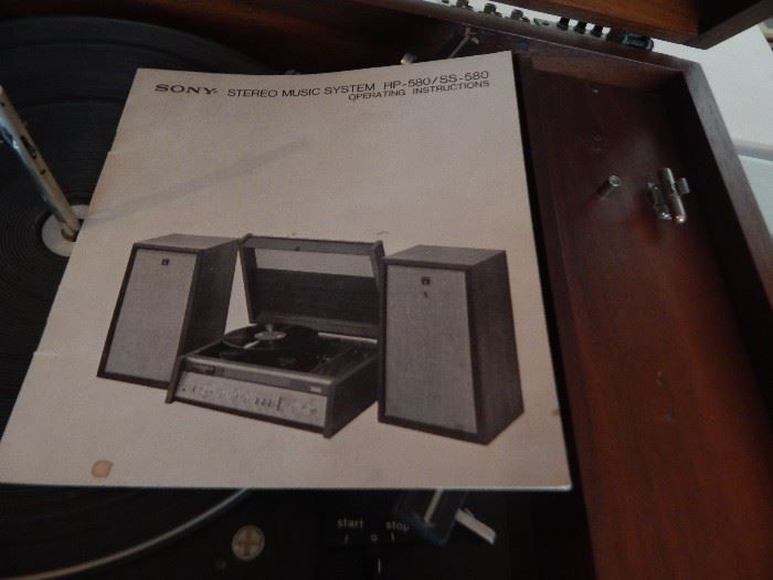 Vintage SONY turn table with speaker system, also stereo AM/FM. Cased in wood.