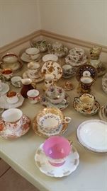 cup and saucer collection pinks, reds, blues, dark light all colors of the rainbow