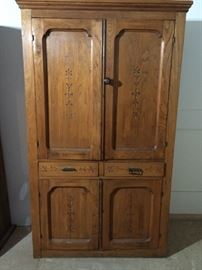 Eastlake cupboard with shelves inside cabinet is located in the Workshop
